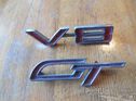 Unidentified badges for a variety of American cars