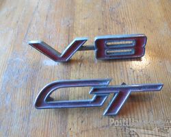 Unidentified badges for a variety of American cars