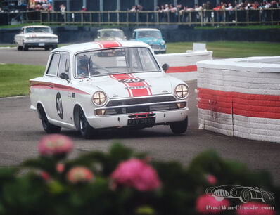 Speed and spray: see the action from a wet, wet, wet Goodwood Revival